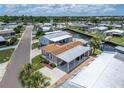 Aerial view of canal-front neighborhood with community pool at 108 W Saint Annes Cir, Apollo Beach, FL 33572