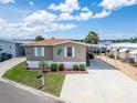 Well-maintained home with a covered carport and beautiful landscaping at 108 W Saint Annes Cir, Apollo Beach, FL 33572