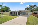 Charming single-story home with a well-maintained lawn and convenient carport, a delightful curb appeal at 11829 104Th St, Largo, FL 33773