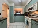 This kitchen features ample storage, modern appliances, and eat-in possibilities at 1286 Mission Hills Blvd, Clearwater, FL 33759