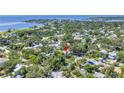 Aerial view of a neighborhood, featuring a quaint home with views of the bay in the distance at 1822 1St Se St, St Petersburg, FL 33705