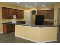 Spacious kitchen featuring plentiful cabinetry, granite countertops and modern appliances at 1835 Fircrest Ct, Wesley Chapel, FL 33543