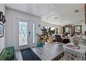 Bright foyer with stylish decor, hardwood floors, and an eye-catching front door welcomes you into the home at 2010 E Vina Del Mar Blvd, St Pete Beach, FL 33706