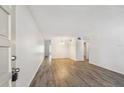 Bright living room with stylish flooring and a view into other rooms, creating an inviting and open space at 2310 Denmark St # 34, Clearwater, FL 33763