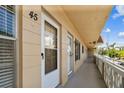 Exterior hallway with unit #45 and views of the neighborhood at 2311 Brisbane St # 45, Clearwater, FL 33763