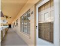 Exterior hallway with unit #45 on the right and bright overhead lighting at 2311 Brisbane St # 45, Clearwater, FL 33763