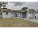 Charming single-story home with a carport and a well-maintained front yard at 3212 34Th N Ave, St Petersburg, FL 33713