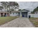 Charming single-story home with a carport and a well-maintained front yard at 3212 34Th N Ave, St Petersburg, FL 33713