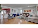Spacious living room featuring hardwood floors and comfortable seating arrangement at 3212 34Th N Ave, St Petersburg, FL 33713