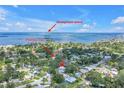 Aerial view showcases the home's proximity to Honeymoon Island and the Pinellas Trail at 412 Mira Vista Dr, Dunedin, FL 34698