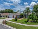 Well-maintained single-story home with lush landscaping and a brick mailbox at 920 Tuscanny St, Brandon, FL 33511