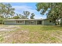 Single story home with a large manicured front yard at 9819 Allen Rd, Lithia, FL 33547