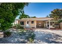 Charming single-story home with a covered carport and well-maintained front yard at 8184 49Th N Ave, St Petersburg, FL 33709