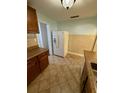 Functional kitchen featuring tiled countertops, appliances, and tile flooring at 1020 85Th N Ave # 223, St Petersburg, FL 33702