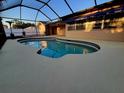 Inviting screened-in pool area with a sparkling blue pool and ample deck space for entertaining at 10218 N Fleetwood Dr, Tampa, FL 33612