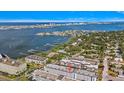 Aerial view showcases the condo's waterfront location and the beautiful surrounding neighborhood at 139 Bluff View Dr # 405, Belleair Bluffs, FL 33770