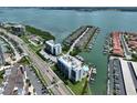 Stunning aerial view of a waterfront condo and marina with boat docks on the inter-coastal waterway at 1591 Gulf Blvd # 304S, Clearwater Beach, FL 33767