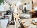 Bright kitchen with modern appliances, ample counter space, and a cozy breakfast nook at 1607 Alexander Crossing Way, Sun City Center, FL 33573