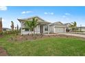 Charming one-story home with a two-car garage, landscaped front yard and brick driveway at 16427 Sapphire Point Dr, Lakewood Ranch, FL 34211