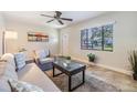 Bright living room with natural light, comfortable seating, and views of the neighborhood at 201 W Alva St, Tampa, FL 33603