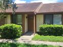 Cozy townhouse featuring manicured landscaping and a welcoming front entrance at 209 Corkwood Ln Ln, Oldsmar, FL 34677