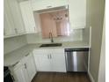 Modern kitchen with stainless steel appliances and white cabinetry at 209 Corkwood Ln, Oldsmar, FL 34677