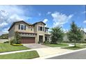 Beautifully landscaped two-story home with a spacious front yard at 3984 Maurice Ave, Odessa, FL 33556