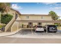 Spacious two-story condo with covered parking and well-maintained landscaping and direct access to unit at 501 E Bay Dr # 802, Largo, FL 33770