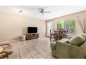 Comfortable living area with tile flooring, ceiling fan and lots of natural light at 501 E Bay Dr # 802, Largo, FL 33770