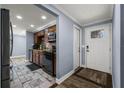Kitchen featuring wood cabinets, stainless steel appliances, and tiled floors at 5346 Black Pine Dr, Tampa, FL 33624