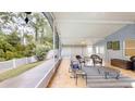 Enclosed patio with lots of space for lounging with tile floors and a ceiling fan at 7010 Kendall Heath Way, Land O Lakes, FL 34637