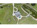 An aerial view of the home, pool, pond, and surrounding acreage at 7301 Loghouse Rd, Plant City, FL 33565