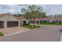 Residential street view of villas with barrel tile roofs and well-maintained landscaping at 8701 40Th N Ln, Pinellas Park, FL 33782