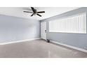 Bright, expansive bedroom with a large window providing ample natural light and tiled floors at 9310 N 12Th St, Tampa, FL 33612
