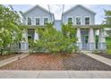 Charming blue two-story home with a welcoming front porch and well-maintained landscaping at 1410 E Curtis St # 2, Tampa, FL 33603