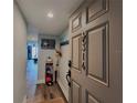 Unit 314 entryway featuring beach-themed decor, providing a welcoming first impression at 18650 Gulf Blvd # 314, Indian Shores, FL 33785