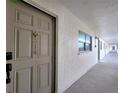 Hallway leading to unit 314, showcasing a secure entrance and common area access at 18650 Gulf Blvd # 314, Indian Shores, FL 33785