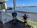 Balcony view showing railing, wooden deck, and waterfront at 219 Pompano Se Dr # D, St Petersburg, FL 33705