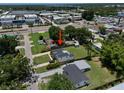 A well-maintained home sits on a lush lot with mature trees at 2306 Cheryl Rd, Largo, FL 33771