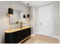 Stylish entryway with modern light fixture, mirror, and decorative console table at 301 1St S St # 1601, St Petersburg, FL 33701
