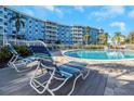 Relaxing poolside scene with lounge chairs, showcasing the condo's outdoor amenities at 3315 58Th S Ave # 421, St Petersburg, FL 33712