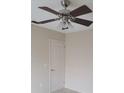 Bedroom showcasing a ceiling fan, a neutral color palette, and a closet for storage at 474 Hinton St, Port Charlotte, FL 33954