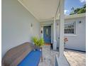 Close up of front entryway featuring a decorative door, sidelight window, and paved patio at 5044 17Th N St, St Petersburg, FL 33714