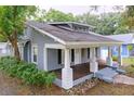 Beautiful single-story home showcases a classic facade with a welcoming front porch and well-maintained yard at 606 N Merrin St, Plant City, FL 33563