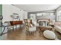 Elegant living room featuring stylish furniture, wood floors, and a cohesive color scheme at 9329 Wellstone Dr, Land O Lakes, FL 34638
