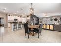 Open floor plan with kitchen island, dining area, and living room at 9839 Lemon Drop Loop, Sun City Center, FL 33573