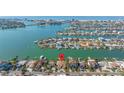 Aerial view of waterfront property, highlighting its prime location and proximity to the bay and beach at 11160 8Th E St, Treasure Island, FL 33706