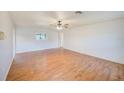 Spacious living room with lots of light and sleek wood laminate flooring at 2063 De Carlo Ave, Spring Hill, FL 34608