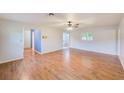 Large living area with pristine walls and beautiful laminate flooring at 2063 De Carlo Ave, Spring Hill, FL 34608