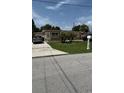 Charming single-story home with well-maintained lawn and landscaping at 2120 W Virginia Ave, Tampa, FL 33607